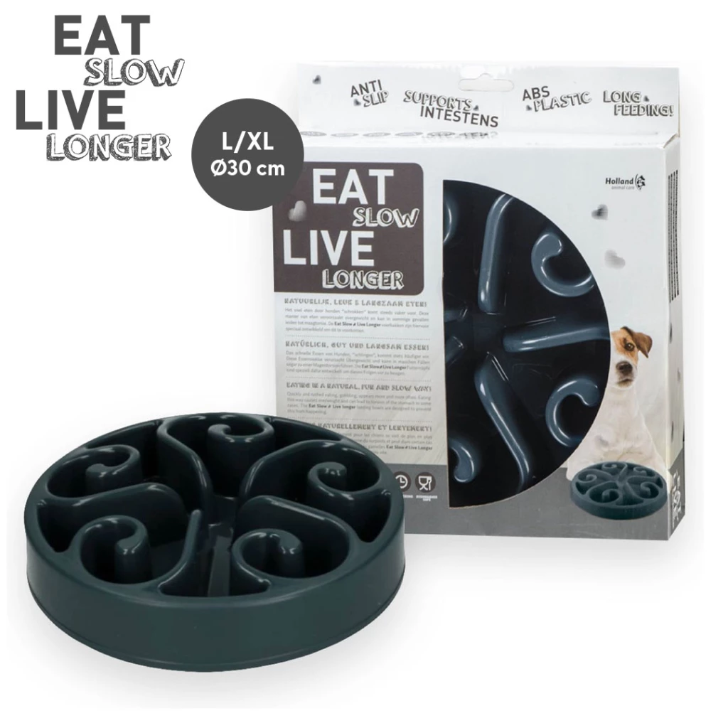 Grauer Napf ‚Eat Slow Live Longer‘ mit Spiralstruktur zur Verlangsamung der Futteraufnahme, in Verpackung mit Hundebild und Hinweisen zu Funktion und Material.