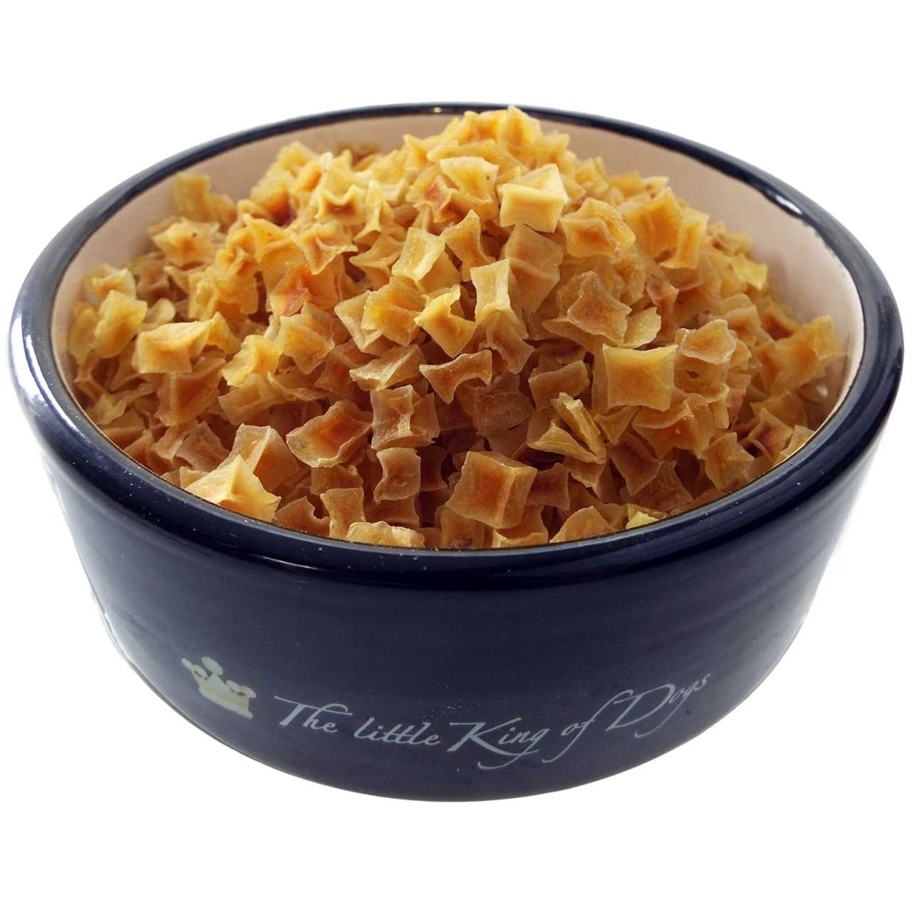 Kleine, gelblich-orange Würfel in matter Optik, lose aufgeschüttet in einer dunklen Futterschale mit hellem Innenrand.