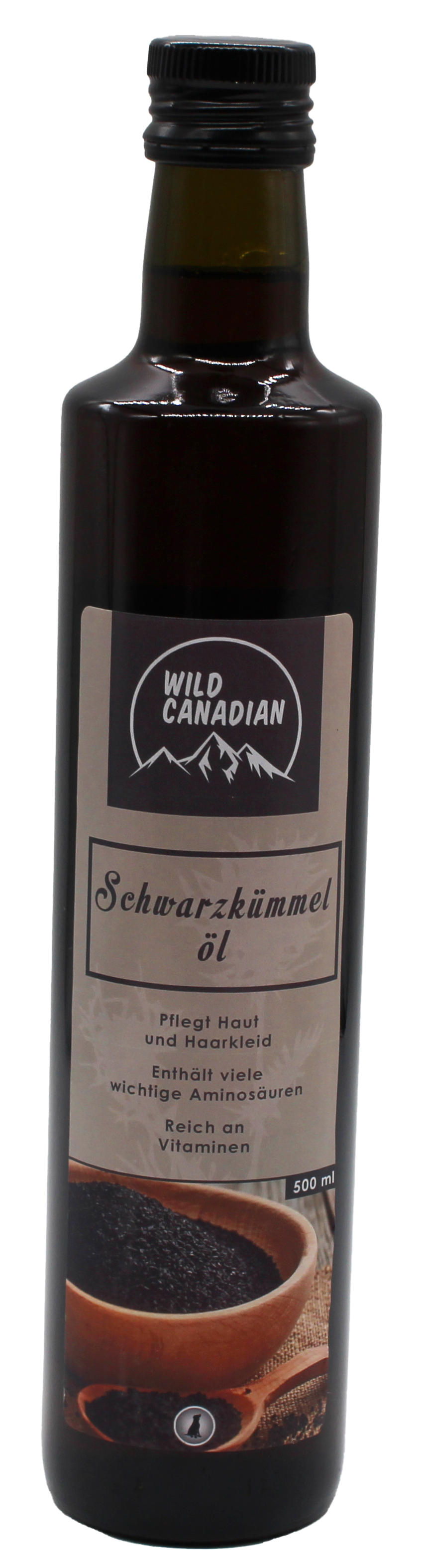 Eine kleine braune Glasflasche mit schwarzem Schraubverschluss und beigem Etikett mit der Aufschrift „Wild Canadian Schwarzkümmelöl“. Ergänzungsfuttermittel für Hunde.