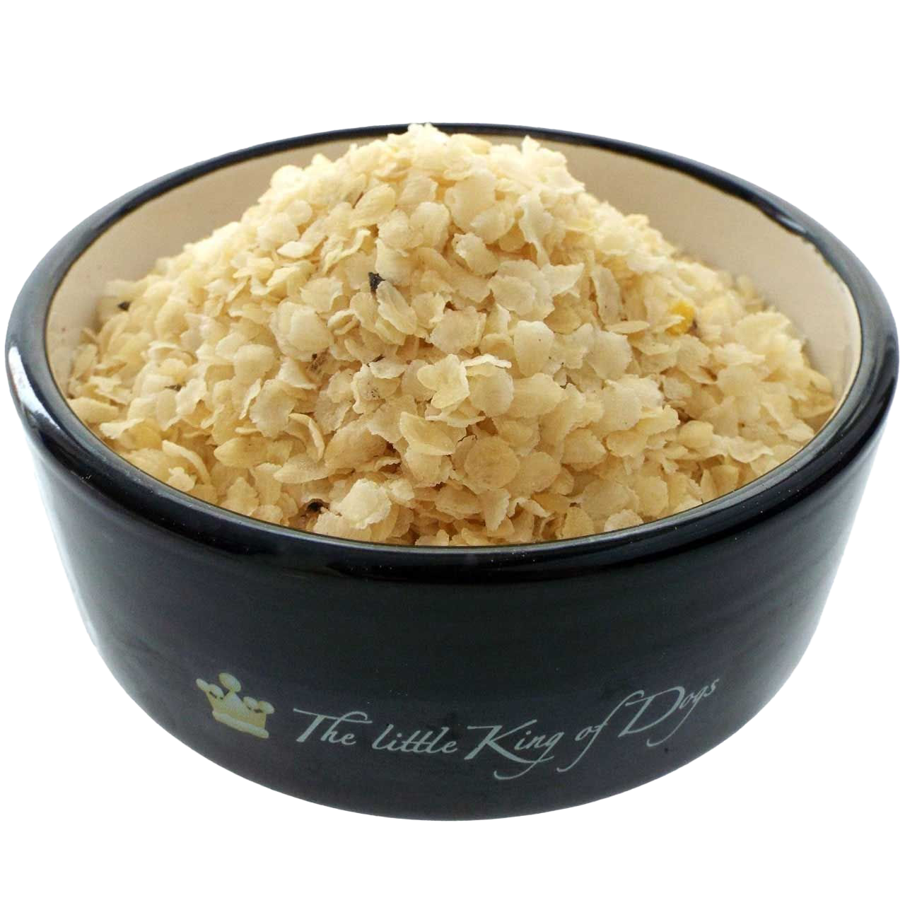 Reisflocken Ein schwarzer Napf mit der Aufschrift „The little King of Dogs“, gefüllt mit blassgelben, dünnen Flocken mit leicht unregelmäßiger, splitterartiger Struktur.Barfen