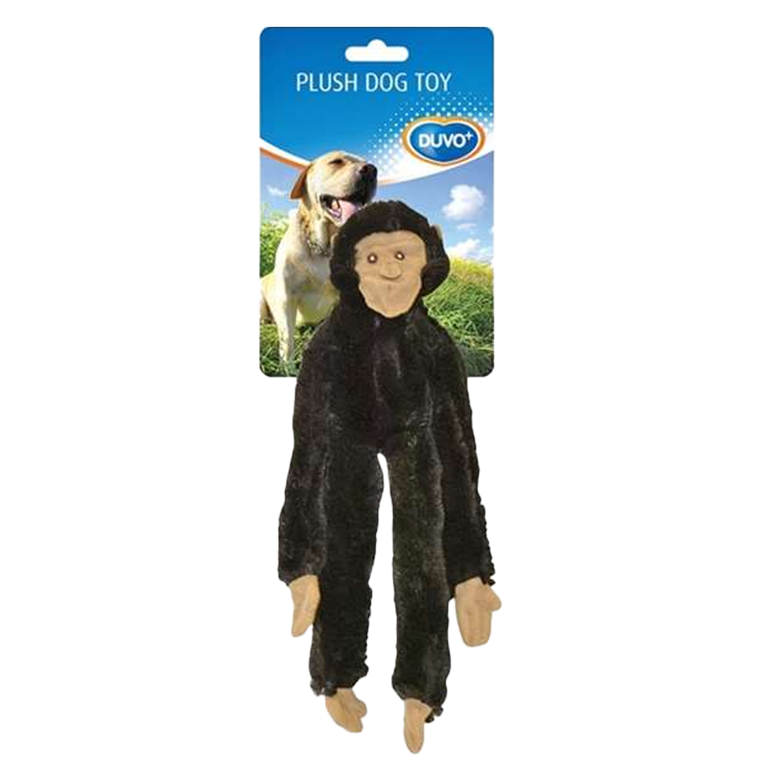 Plüsch-Hundespielzeug in Affenform vor Verpackung mit Hundebild und blauem Himmel mit Wolken.