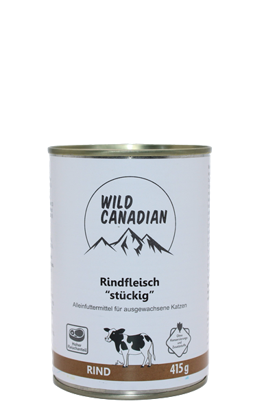 Dose mit Hundefutter, zylindrisch mit weißem Etikett; abgebildet sind Berge und eine Kuh, metallischer Deckel oben, schlichte Gestaltung.