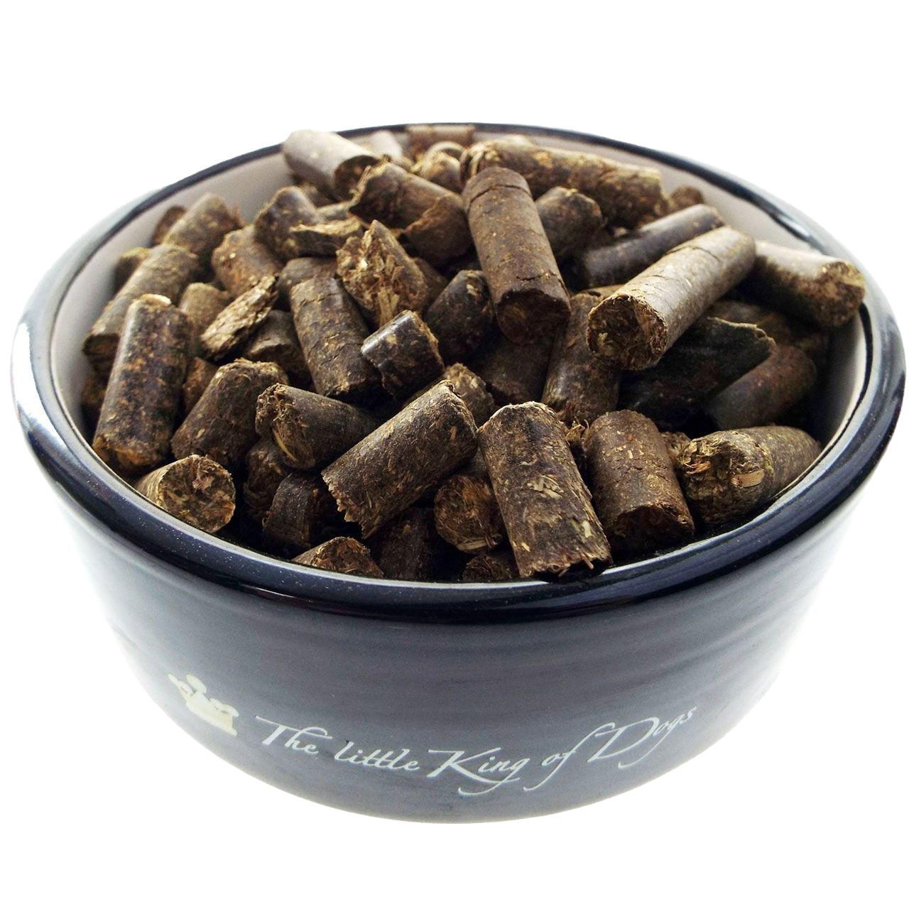 Dunkelbraune Pellets mit grober, faseriger Oberfläche in einer schwarz glänzenden Schale mit weißem Innenrand, locker geschichtet.