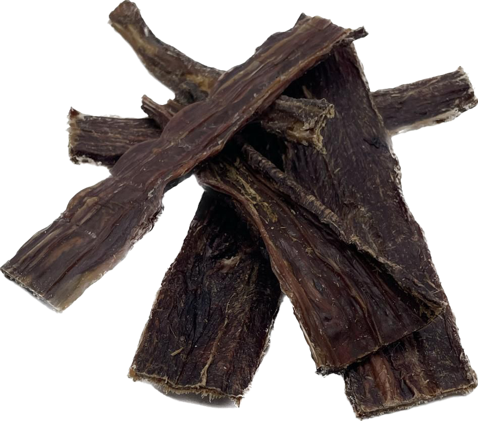  Mehrere längliche, flach gepresste Stücke dunkelbraunen Dörrfleischs mit faseriger Struktur und leicht glänzender Oberfläche. Die Kanten sind unregelmäßig geformt.