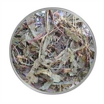 Löwenzahnkraut 500 g Ein rundes Sichtfenster mit einer locker geschichteten Mischung aus groben, getrockneten Blättern und Stängeln in mattem Grün und Braun.