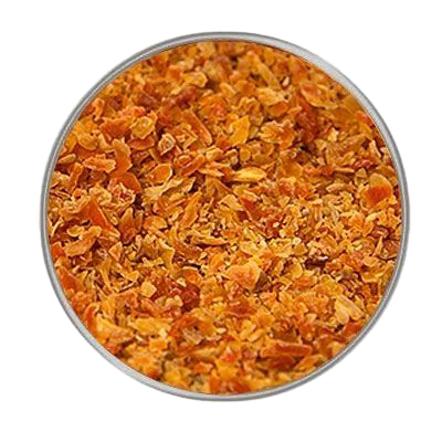 Rundes Fenster mit fein gemahlenem, orangefarbenem Möhrengranulat, gleichmäßig verteilt mit leicht körniger Struktur auf hellem Hintergrund.