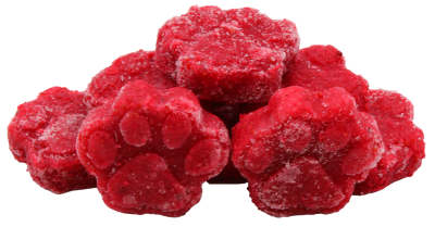 Mehrere gefrorene, leuchtend rote Pfötchen aus pürierten Cranberries, leicht übereinandergestapelt