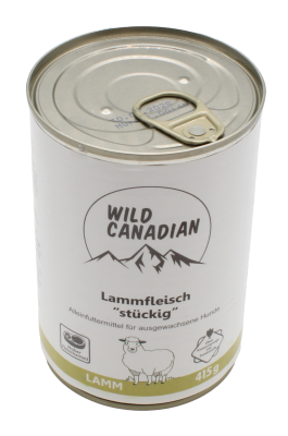 Zylindrische Dose mit Hundefutter, weißes Etikett mit Bergmotiv und Lammillustration; schlichtes Design, metallischer Deckel oben sichtbar.
