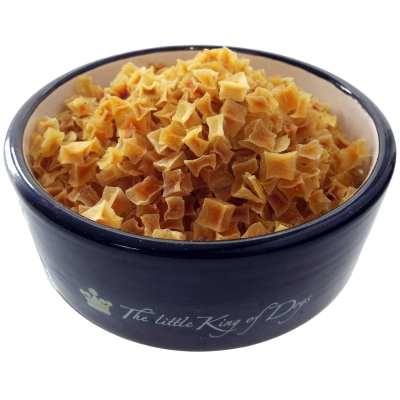 Kleine, gelblich-orange Würfel in matter Optik, lose aufgeschüttet in einer dunklen Futterschale mit hellem Innenrand.