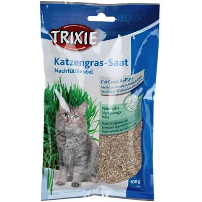 Verpackung mit Bild einer Katze neben grünem Gras, Gestaltung in Blau- und Grüntönen mit weißen Flächen und glatter, rechteckiger Form.