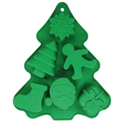 Grüne Silikonbackform in Form eines Weihnachtsbaums mit Mulden: Schneeflocke, Tannenbaum, Lebkuchenfigur, Nikolausstiefel, Weihnachtsmann und Geschenk