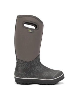 Grauer Gummistiefel mit floralem Muster, Grifföffnung am Schaft und schwarzer, stark profilierter Sohle.