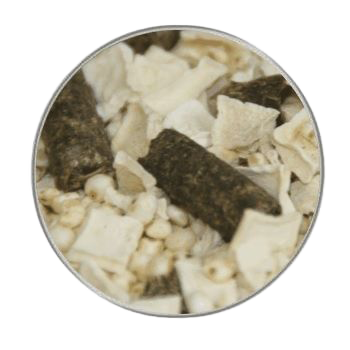 Ein Rundbild mit einer groben Trockenmischung aus weißen Würfeln, gepufften Körnchen und dunklen Presslingen. Die Farben reichen von Beige bis Dunkelbraun.