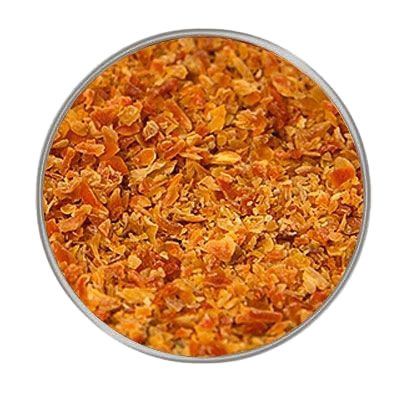 Rundes Fenster mit fein gemahlenem, orangefarbenem Möhrengranulat, gleichmäßig verteilt mit leicht körniger Struktur auf hellem Hintergrund.